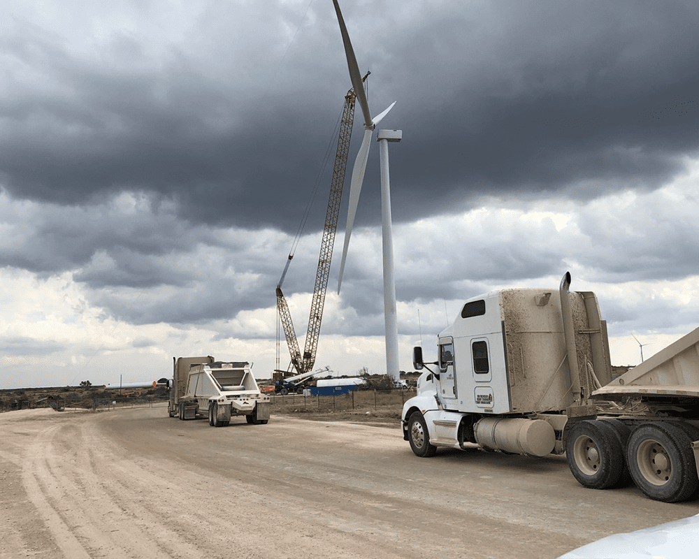 Dump Trucks Driving Through Aviator Wind Farm