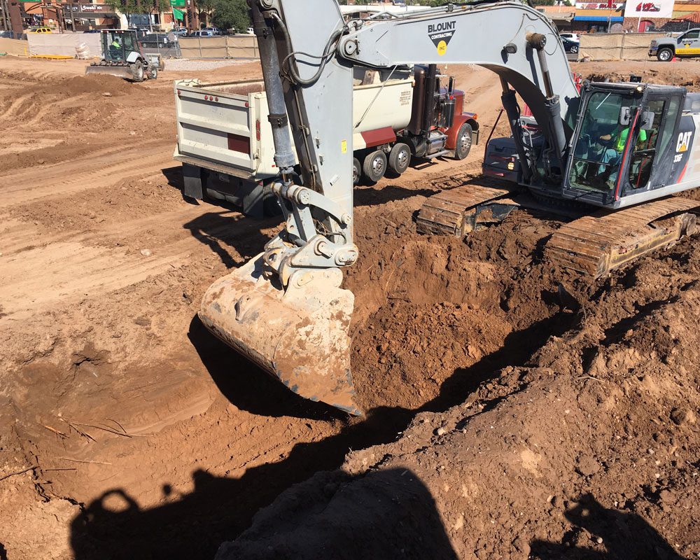 CAT Bulldozer Moving Dirt at Job Site