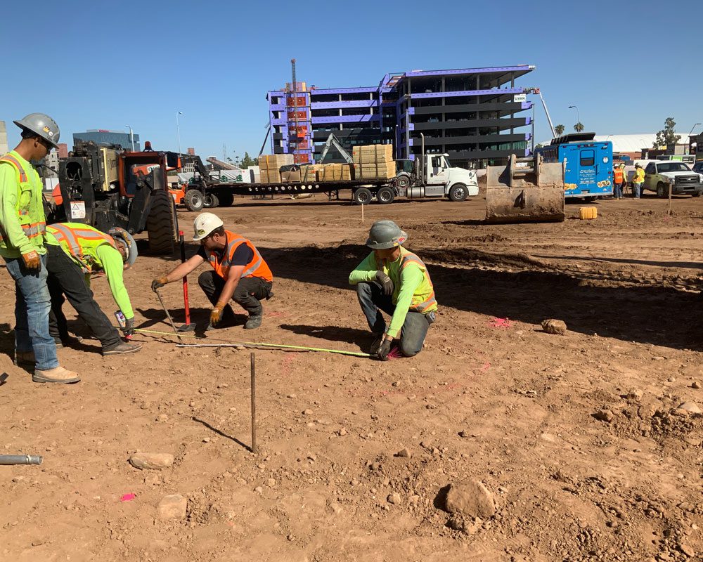 Blount Crew Measuring a Section of the Job Site at ASU ISTB7
